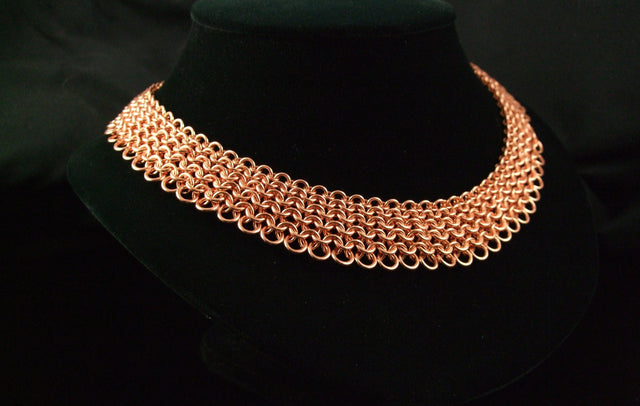 Copper European 4-in-1 chainmaille collar on a black display bust