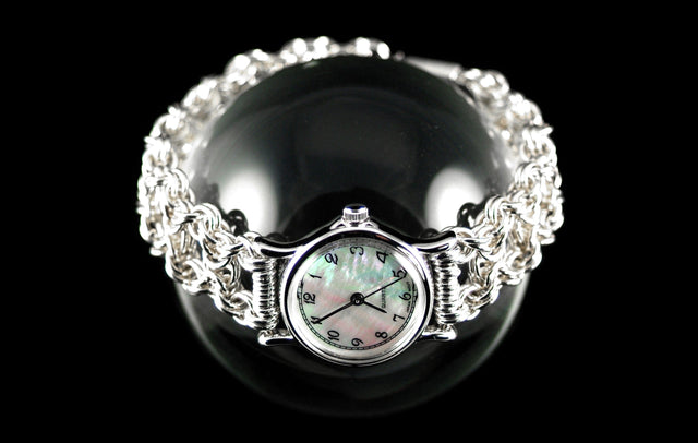 Byzantine Watch with sterling silver chainmaille band and mother-of-pearl watch face on a glass sphere, black background, Urban Maille