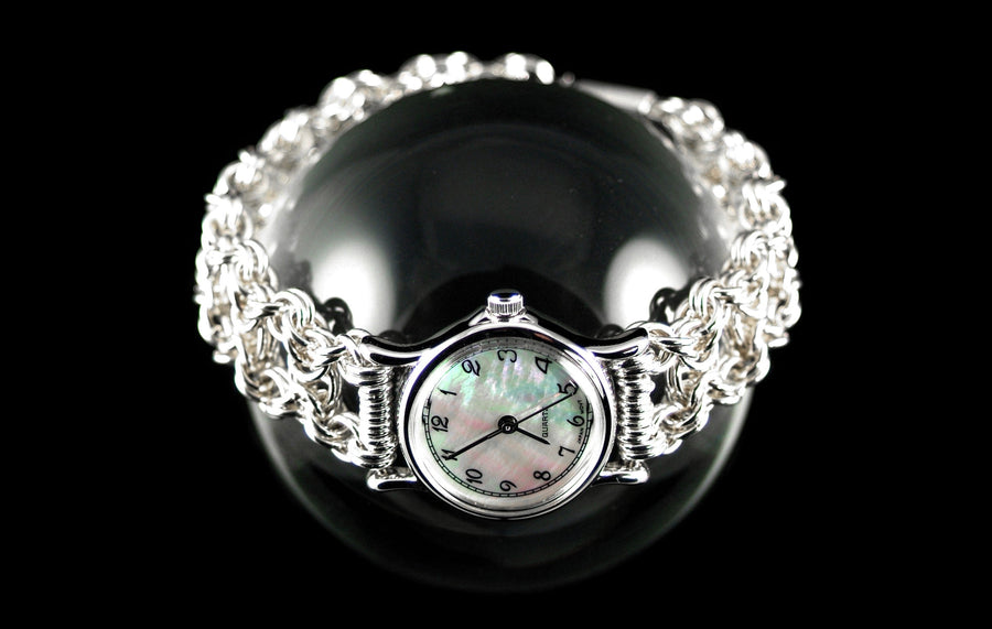 Byzantine Watch with sterling silver chainmaille band and mother-of-pearl watch face on a glass sphere, black background, Urban Maille