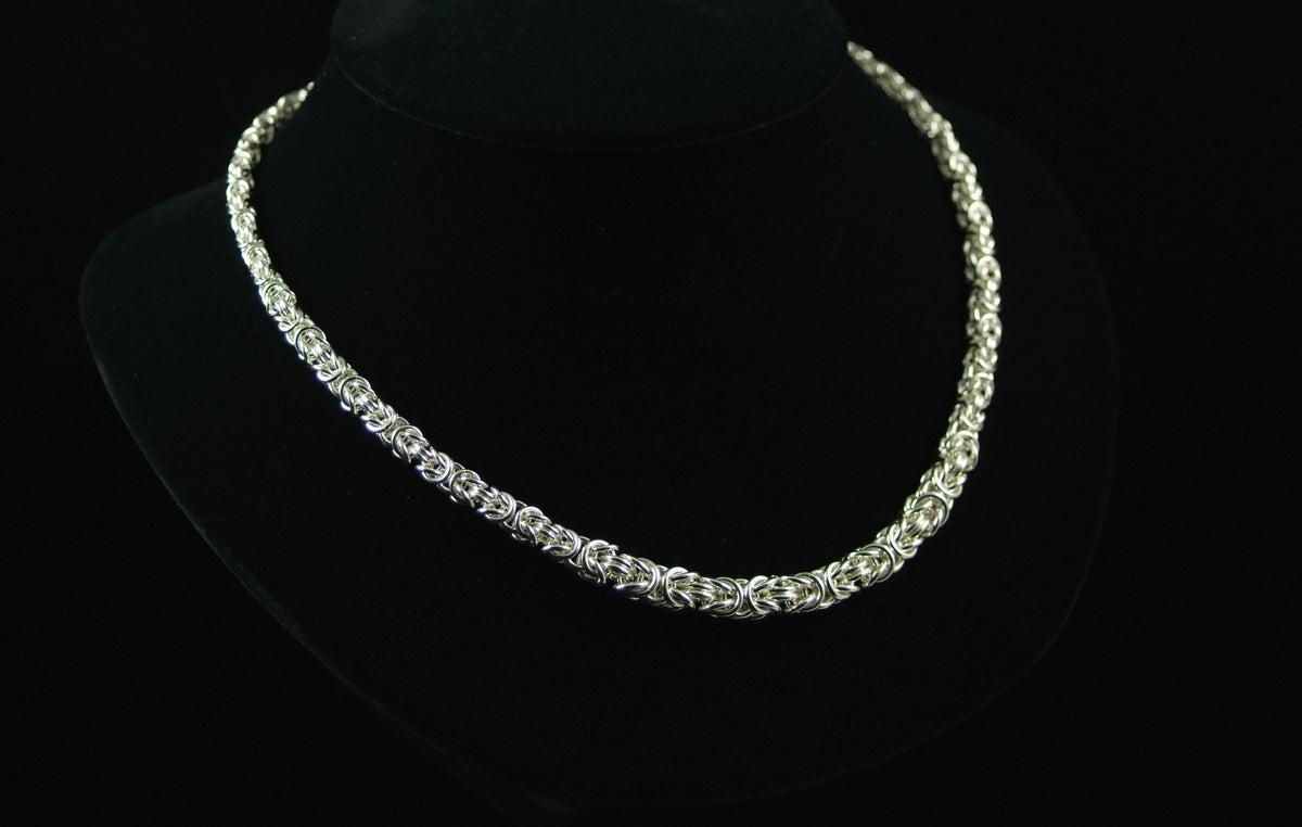 Delicate Graduated Byzantine Necklace in silver chainmaille on a black bust, Urban Maille