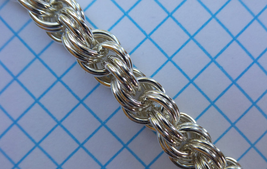 Double Spiral 4-in-1 chainmaille chain in sterling silver on graph paper
