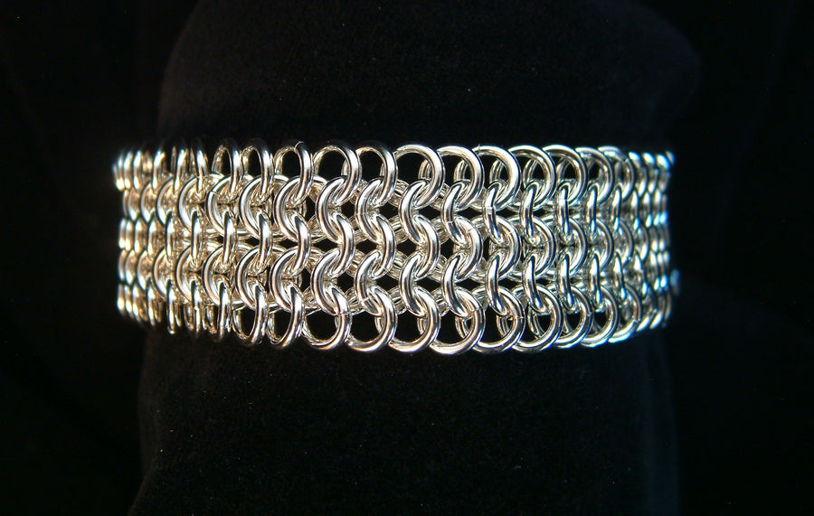 Wide sterling silver European 4-in-1 chainmaille bracelet on a black velvet display, Urban Maille