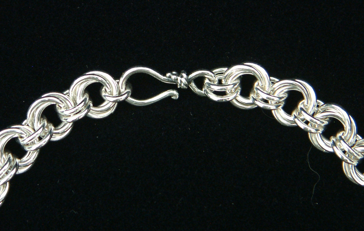 Sterling silver Flower Chain chainmaille bracelet with hook clasp on black velvet, Urban Maille