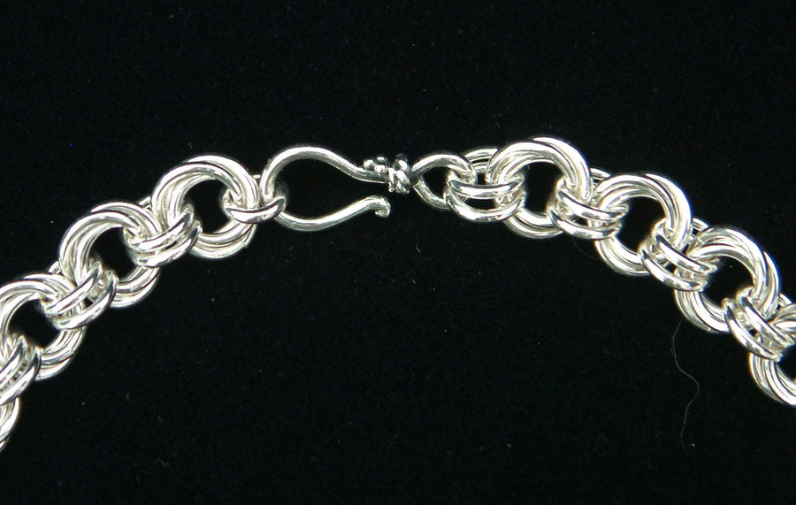 Sterling silver Flower Chain chainmaille bracelet with hook clasp on black velvet, Urban Maille