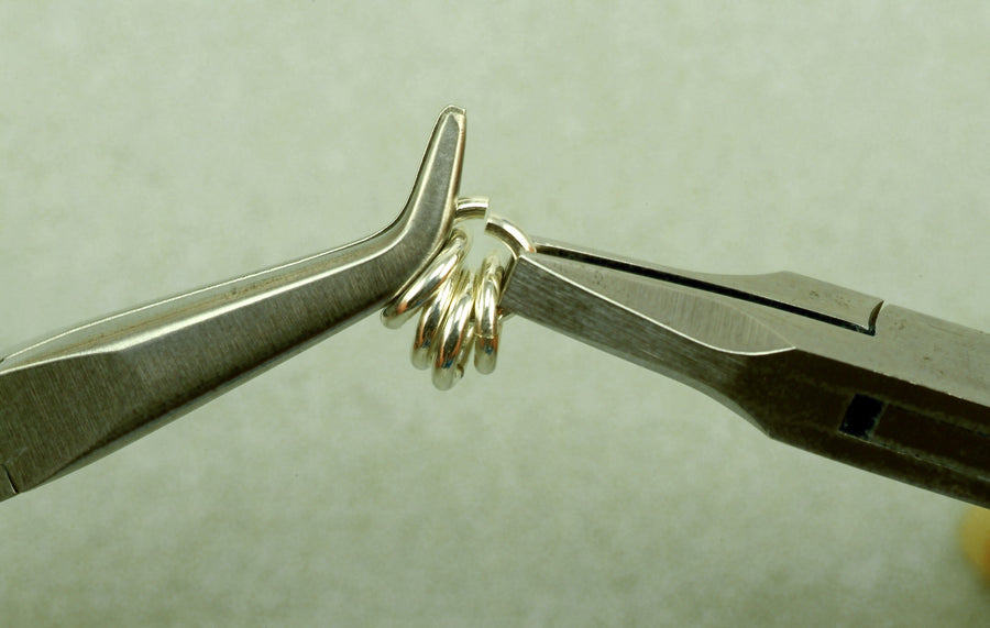 Chain-nose pliers closing a silver jump ring, Urban Maille