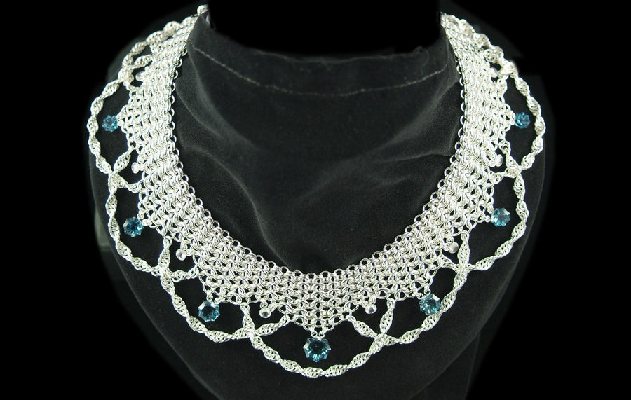 Camelot: sterling silver chainmaille collar necklace in graduated European 4-in-1 with single spiral draping chains and London Blue Topaz drops, on a black velvet bust, Urban Maille