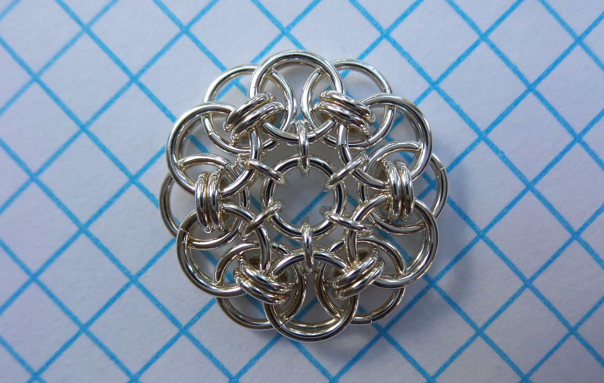 WallFlowers chainmaille medallion in silver on graph paper, Urban Maille