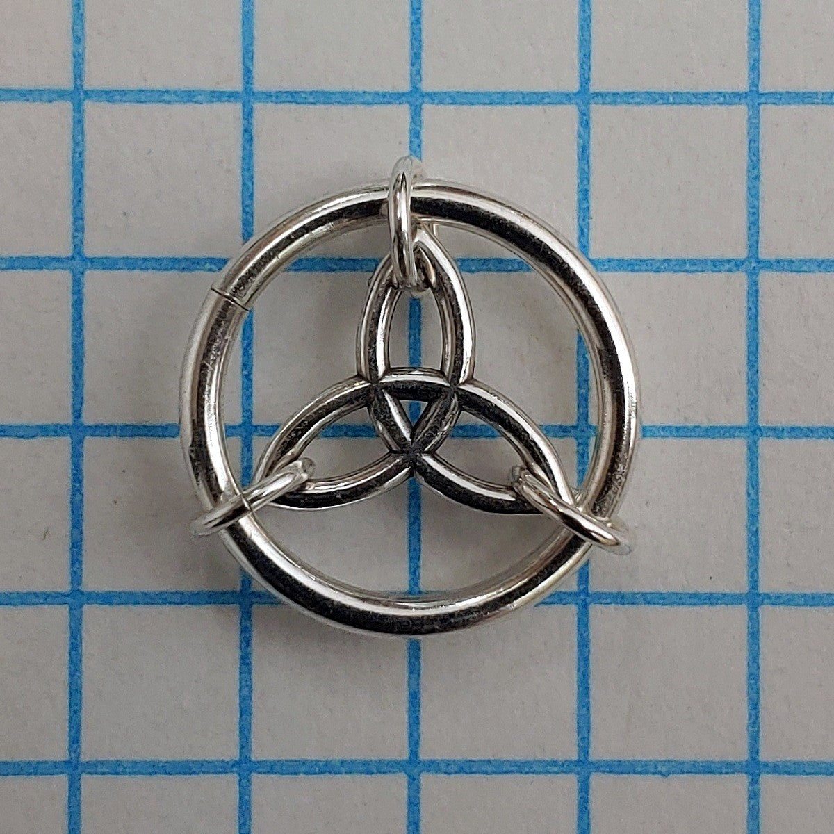 Celtic Triquetra medallion on grid